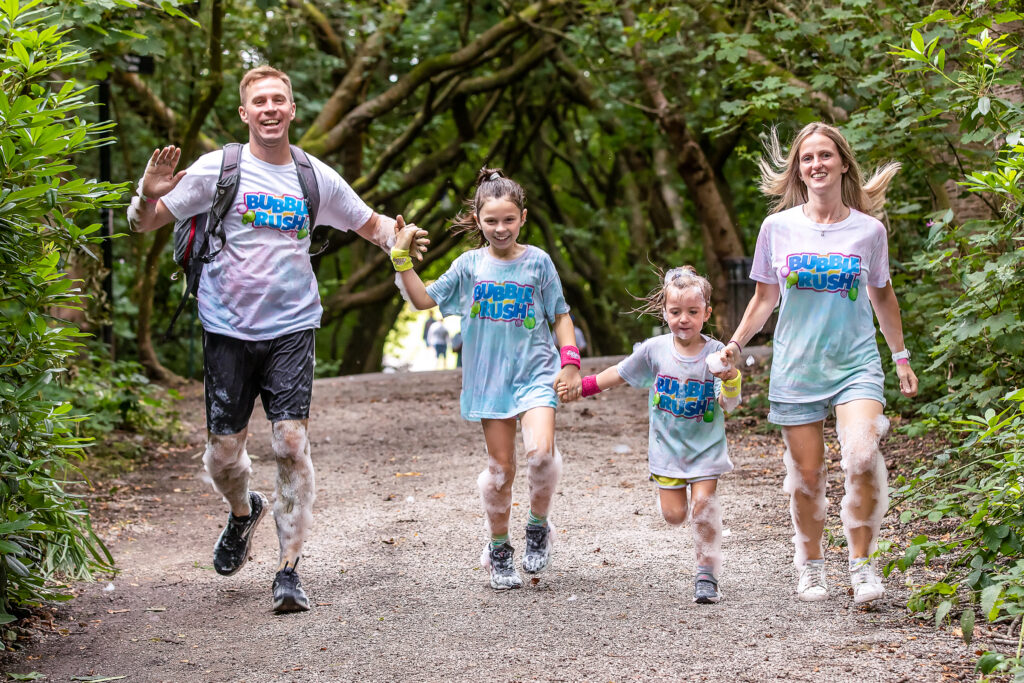 Family Skipping at Bubble Rush 5k Fun Run