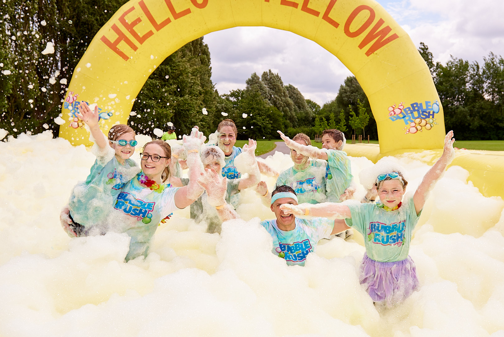 Smiling People taking Part In Bubble Rush