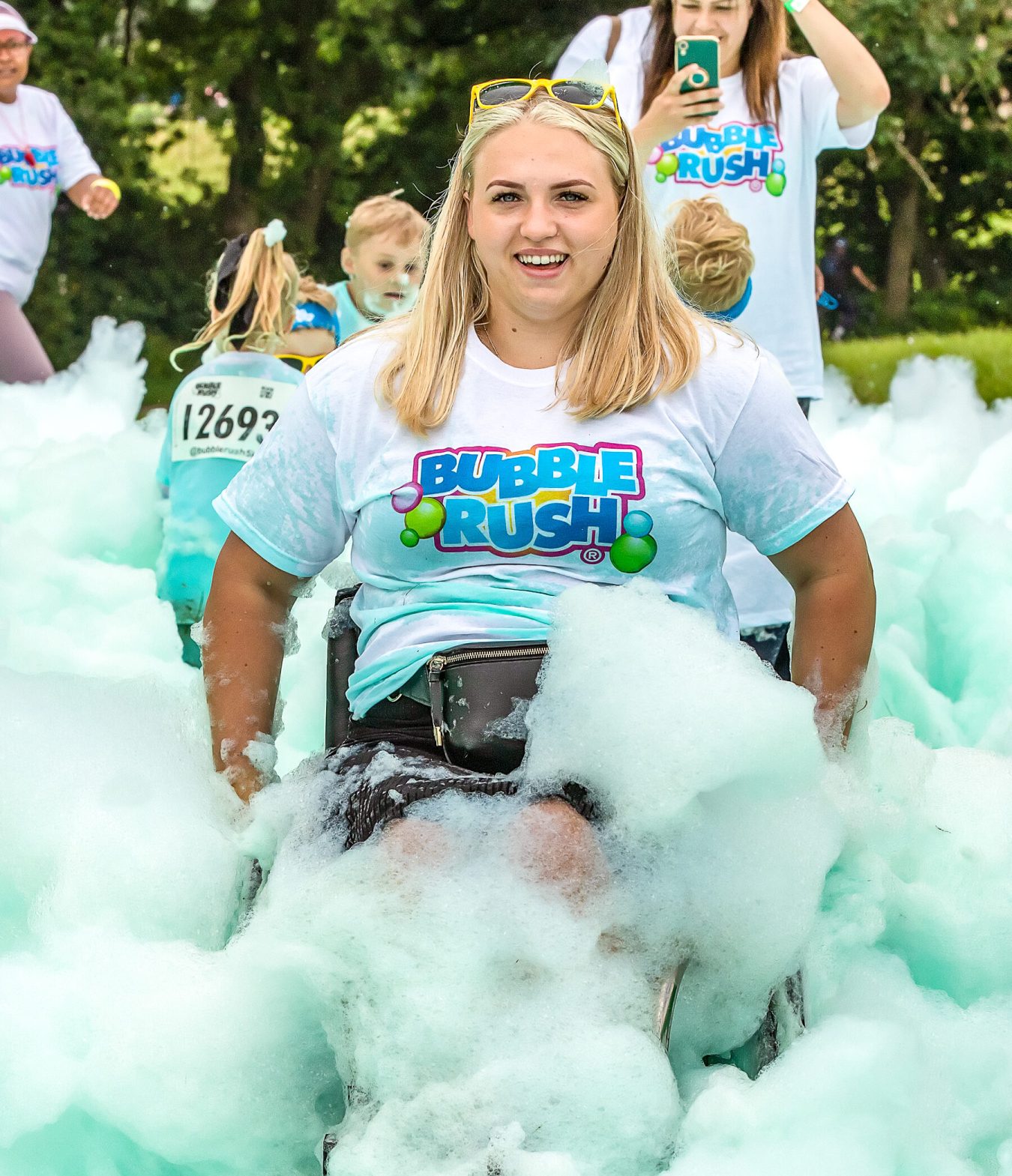 Woman Happy Taking Part In Bubble Rush In Her Wheelchair